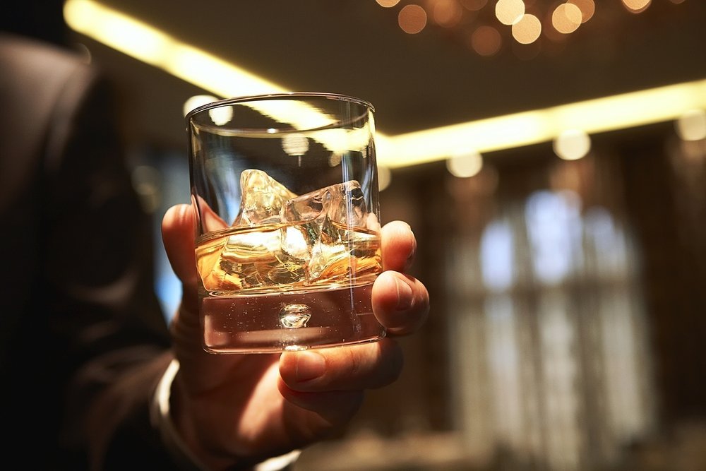 Holding a Glass of Scotch