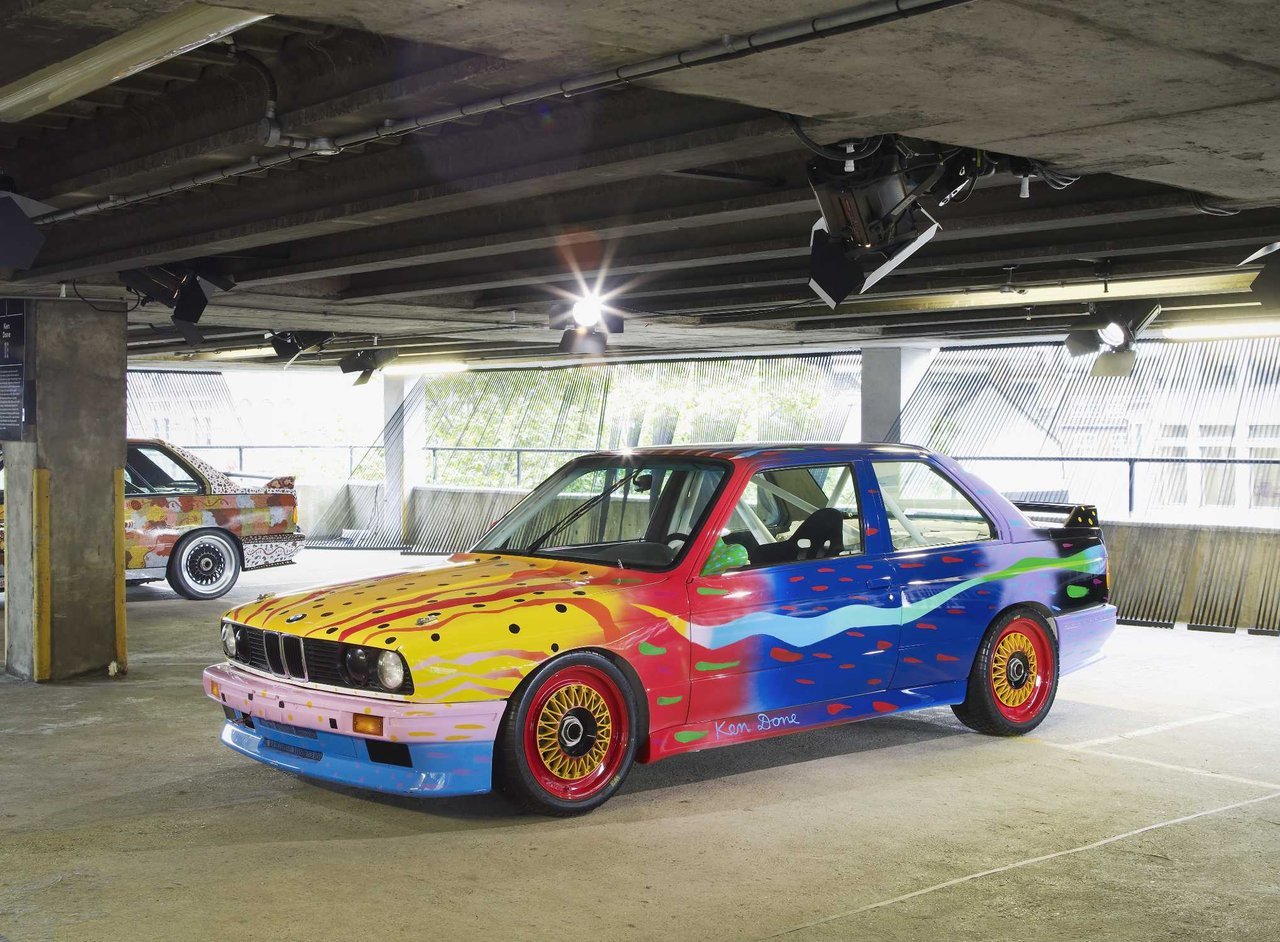Bright, happy, colors and simple painted parrots and parrot fish cover Ken Done's BMW Art Car.
