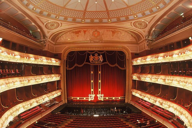 Onlooking the balcony levels at the red-and-gold interior of the Royal Opera House