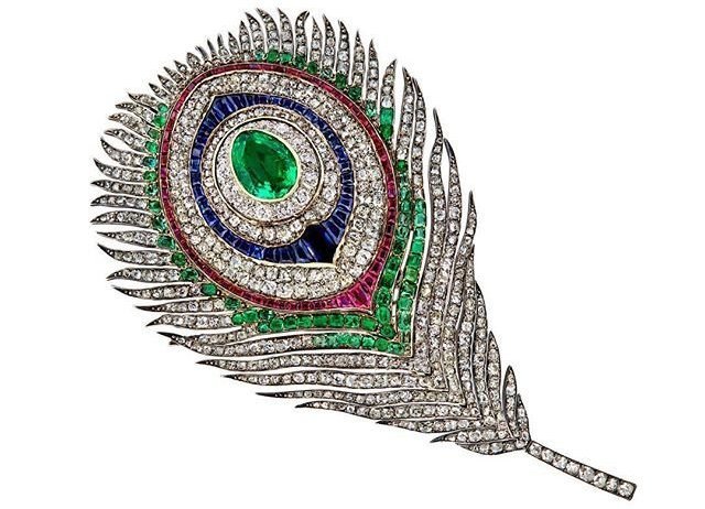 Feather brooch with diamonds, emeralds, and sapphires