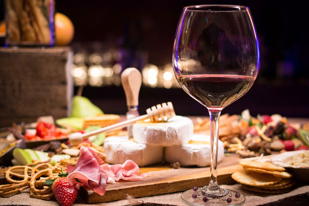 Wine, meat, and cheese plate A Romantic Dinner at Home: Your Menu Planning Guide 